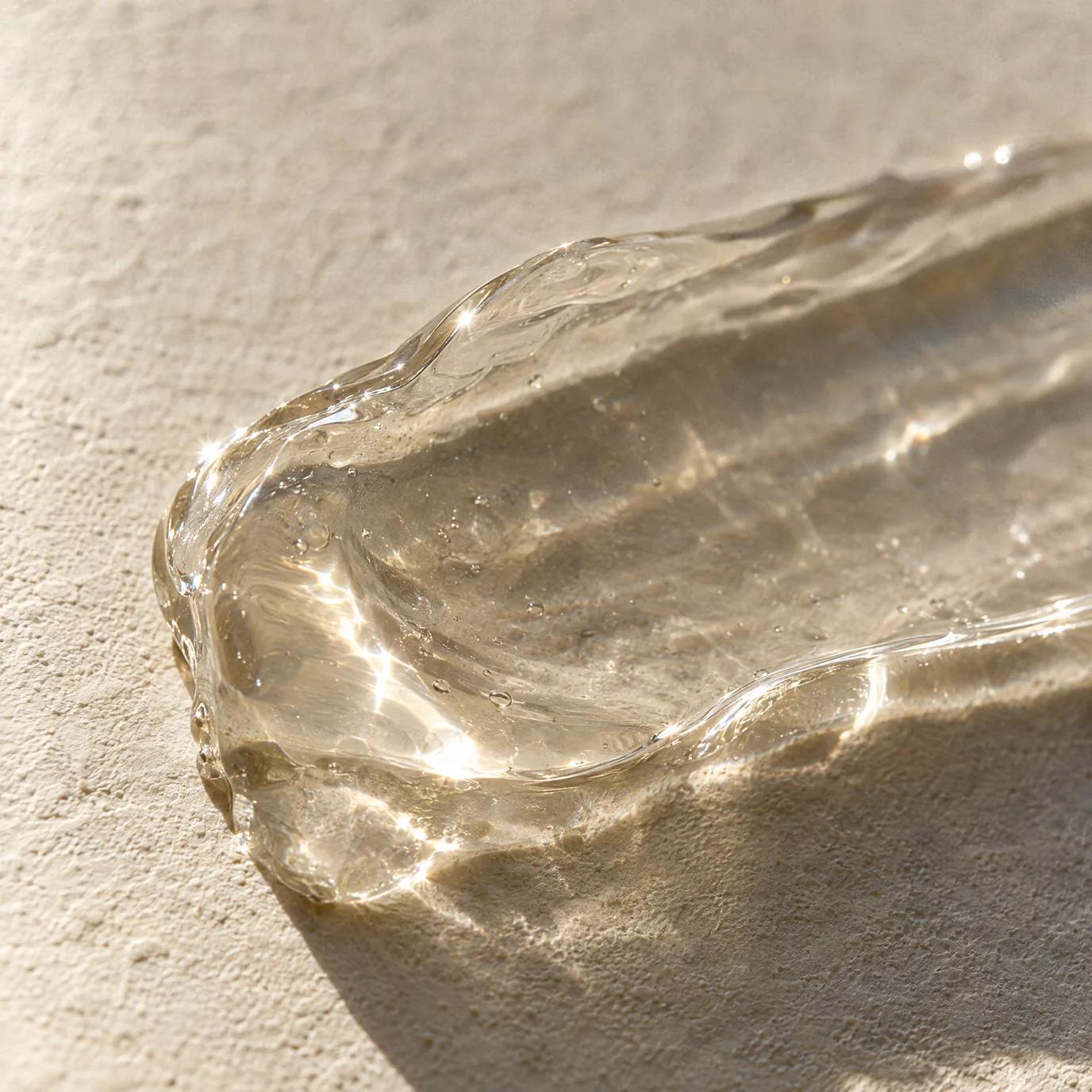 A translucent gel sculpted into a ridge, light gathering in its edges.